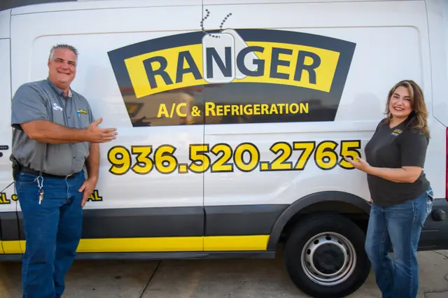 Ranger A/C & Refrigeration owners standing with their branded service van
